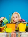 Woman planting flowers in pot. Beautiful young woman gardening. Watering flowers. Gardener woman planting flowers. Cute Royalty Free Stock Photo