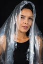 A woman with a plastic bag over her head in the form of a veil. Protest against the use of plastic. Environmental problems Royalty Free Stock Photo