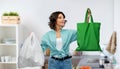 Woman with plastic and reusable shopping bag