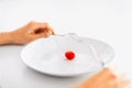 Woman with plate and one tomato Royalty Free Stock Photo