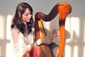 Woman play celtic harp