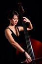 Woman play classic contrabass using