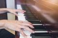 Woman play piano in class room. Royalty Free Stock Photo