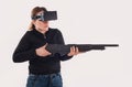 Woman play VR shooter game with vr glasses and rifle Royalty Free Stock Photo