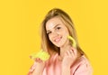 Woman play with yellow feather, tender touch concept Royalty Free Stock Photo