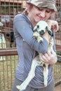 Woman playing with a baby goat Royalty Free Stock Photo