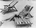 Woman playing backgammon on beach Royalty Free Stock Photo