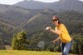 Woman playing badminton in mountains on sunny day. Space for text Royalty Free Stock Photo