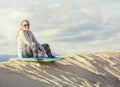 Woman Playing and boarding in the Sand Dunes Royalty Free Stock Photo