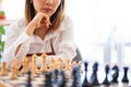 Woman playing chess in club