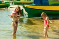 Woman playing with children on beach Royalty Free Stock Photo