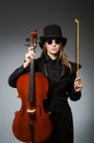 Woman playing classical cello in music concept