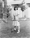 Woman playing croquet in the yard Royalty Free Stock Photo