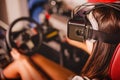 Woman playing game in virtual reality glasses Royalty Free Stock Photo
