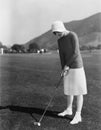 Woman playing golf Royalty Free Stock Photo