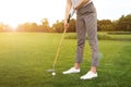 Woman playing golf in park. Sport and leisure Royalty Free Stock Photo