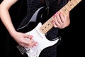 Woman playing on guitar