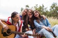 Woman playing guitar nature tourism happy concept.