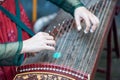 Woman playing Guzheng traditional chinese music instrument Royalty Free Stock Photo