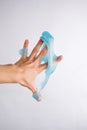 Woman Playing Hand Made Toy Called Slime on Withe Background.