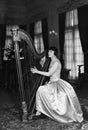 Woman playing harp