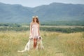 Woman playing with her dog in the street Royalty Free Stock Photo