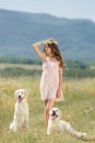 Woman playing with her dog in the street Royalty Free Stock Photo