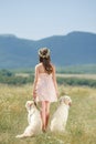 Woman playing with her dog in the street Royalty Free Stock Photo