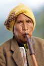 Woman playing Lusheng wind instrument