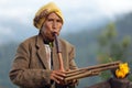 Woman playing Lusheng wind instrument