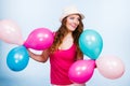 Woman playing with many colorful balloons Royalty Free Stock Photo