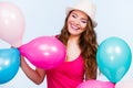 Woman playing with many colorful balloons Royalty Free Stock Photo