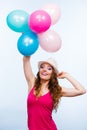 Woman playing with many colorful balloons Royalty Free Stock Photo