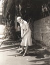 Woman playing miniature golf Royalty Free Stock Photo