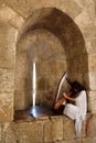 Woman playing an old string musical instrument Royalty Free Stock Photo