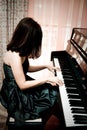 Woman playing piano Royalty Free Stock Photo