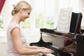 Woman playing piano Royalty Free Stock Photo