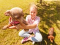 Woman playing pinscher ratter dog outside