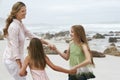 Woman Playing Ring Around The Rosy With Daughters Royalty Free Stock Photo