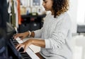 Woman playing song on piano alone