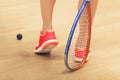 Woman playing squash Royalty Free Stock Photo