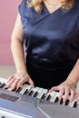 Woman playing synthesizer, women hands on piano keys Royalty Free Stock Photo