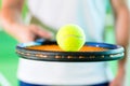 Woman playing tennis in fitness club Royalty Free Stock Photo