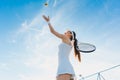 Woman playing tennis giving service Royalty Free Stock Photo