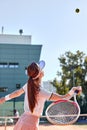 woman playing tennis hitting ball, caucasian athlete female throwing racket Royalty Free Stock Photo