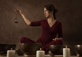 Woman playing tingsha (Tibetan bells) Royalty Free Stock Photo