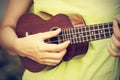 Woman playing ukulele, vintage style