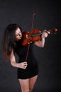 Woman playing violin Royalty Free Stock Photo