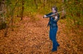 Woman playing violin in autumn park Royalty Free Stock Photo