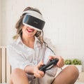 Woman playing with virtual reality glasses.